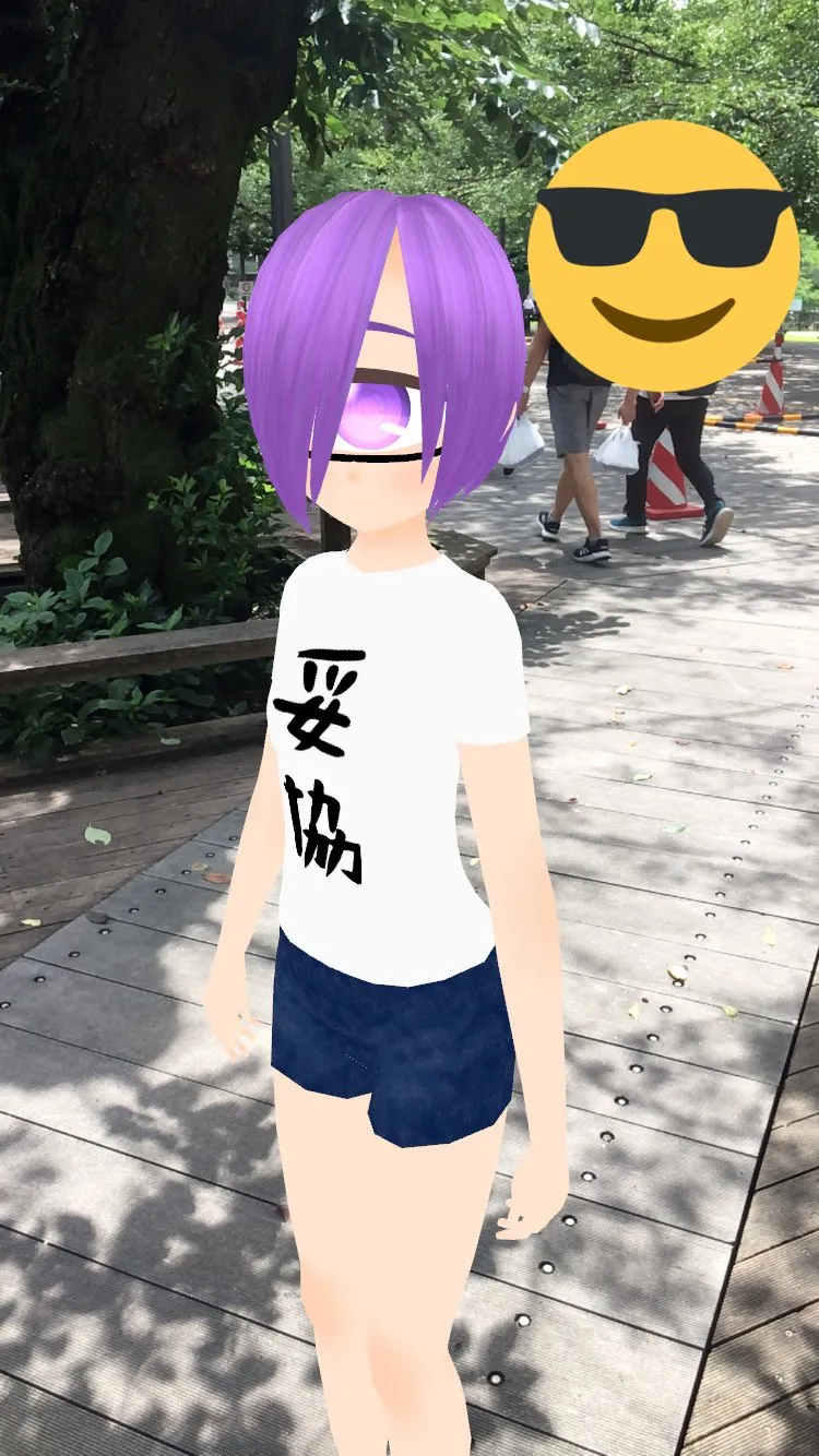 A girl with purple hair wearing a white t-shirt with Japanese characters and navy shorts, standing on a park pathway with trees and other people in the background